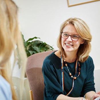 Doctor speaking to a young woman