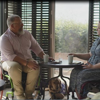 Veterans in civilian clothes at a table having a chat
