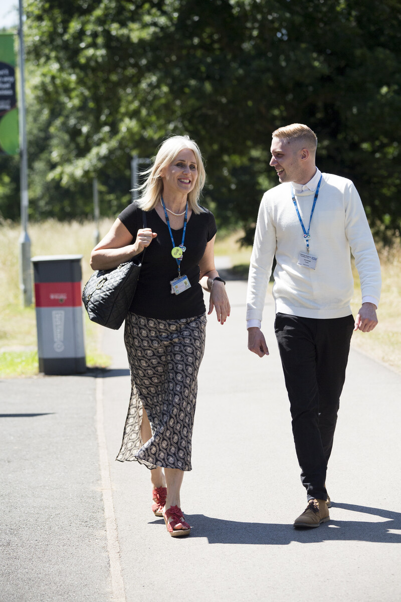 photo of two Berkshire Healthcare colleagues walking and talking