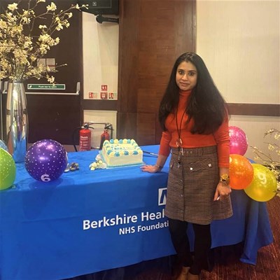 Lumbini Vithana next to a cake
