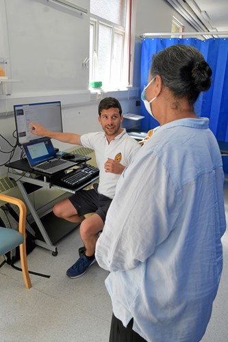 Two staff members talking on our ward
