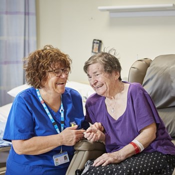 Berkshire Healthcare staff member caring for a patient in a hospital setting