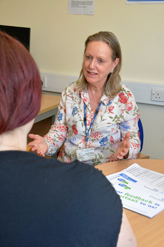 A mental health professional talking to a patient