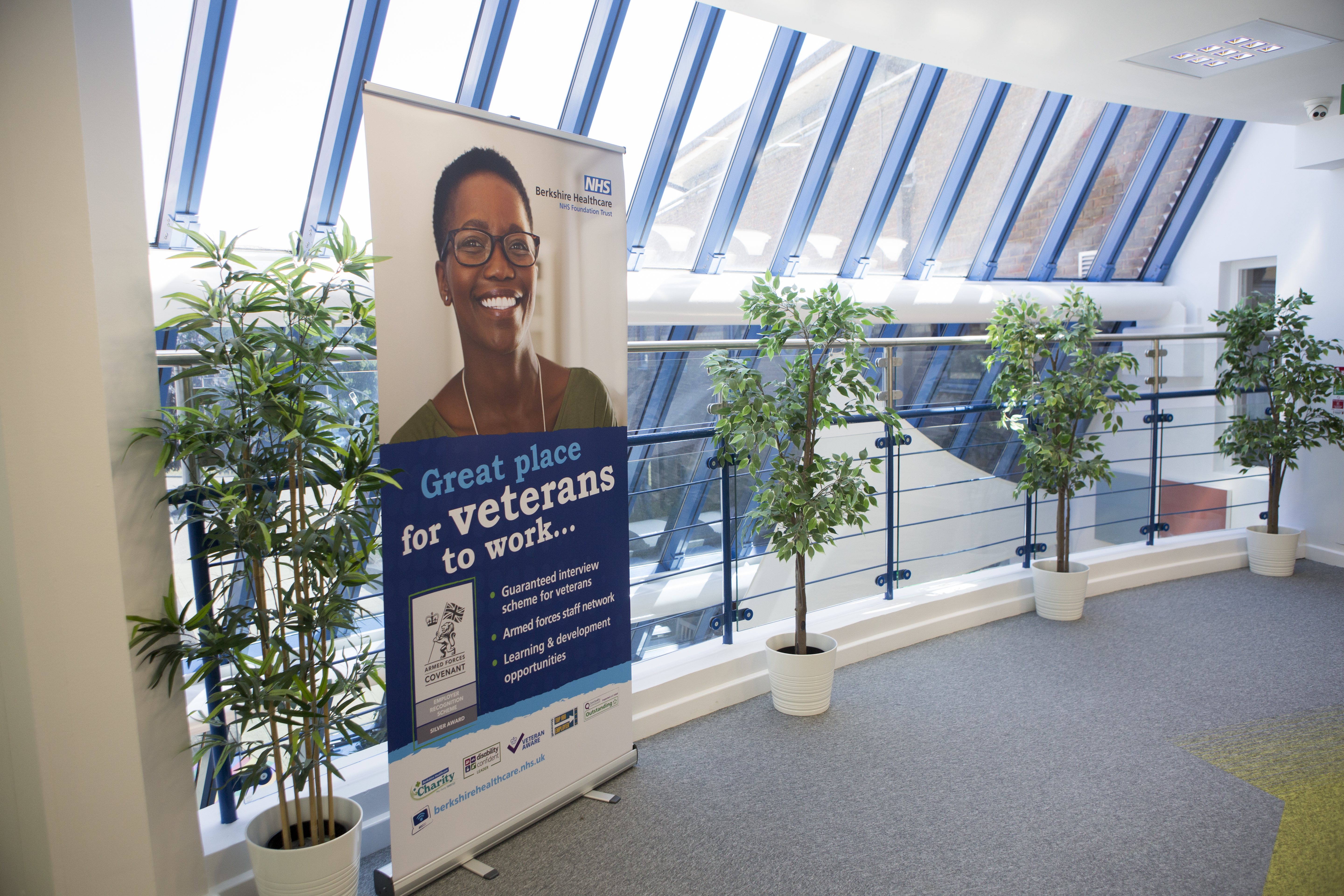 A picture of our veterans pop up banner in a hallway
