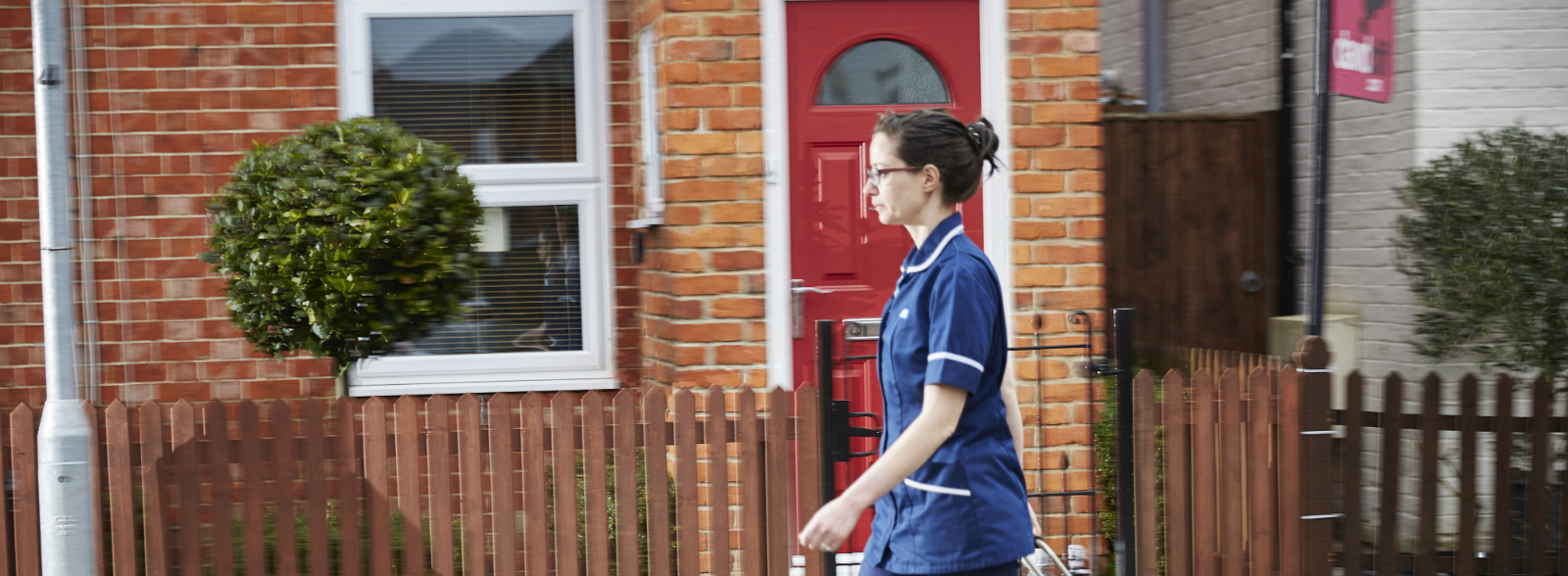 Community Nurse walking down the road
