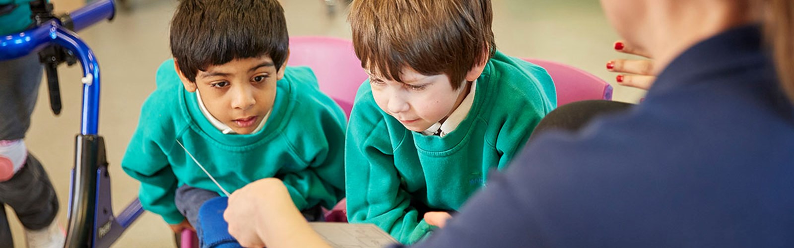 Two children learning with a speech and language therapist