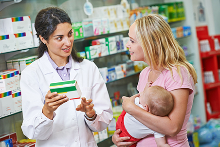 Pharmacist with woman and child