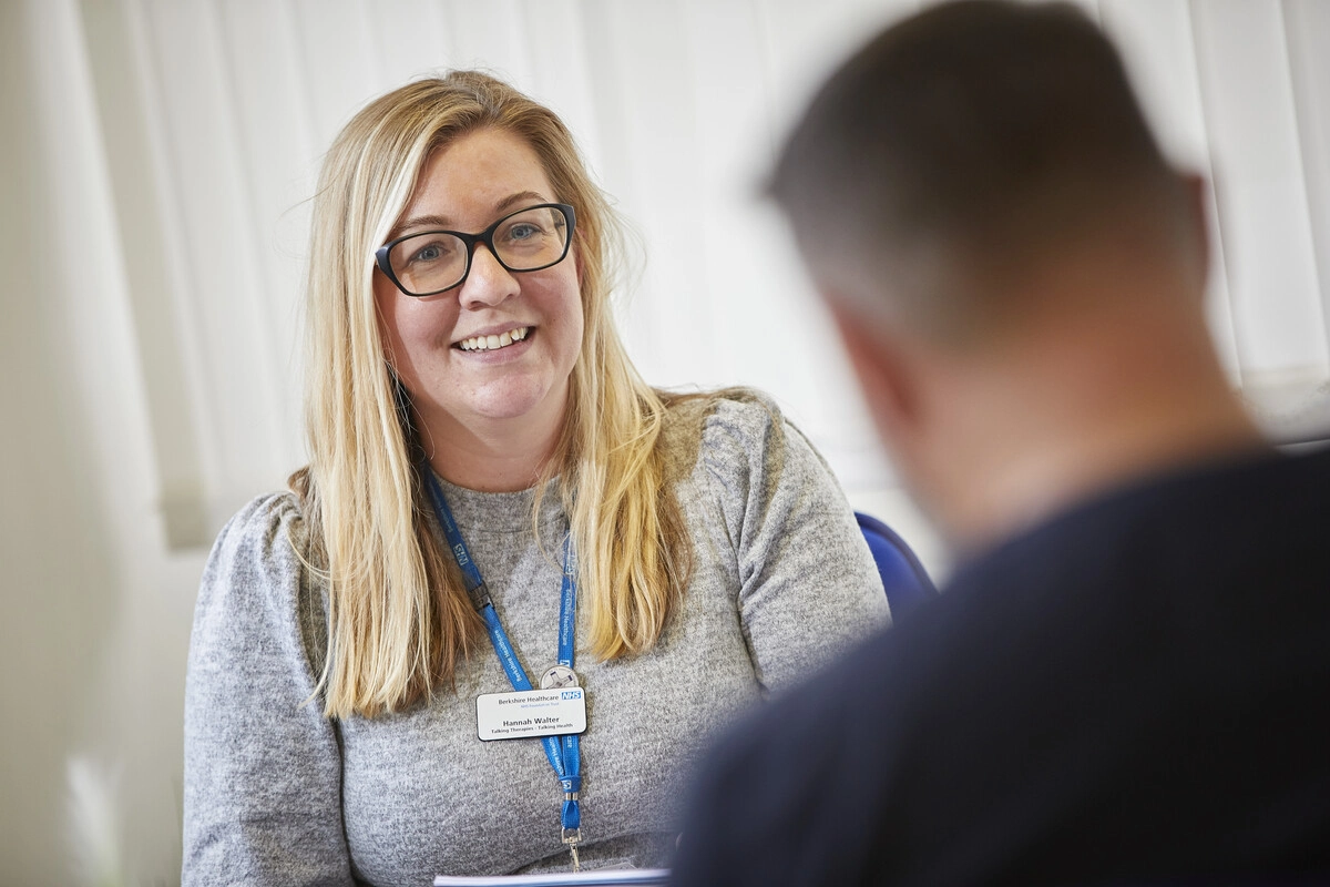 Therapist talking to patient