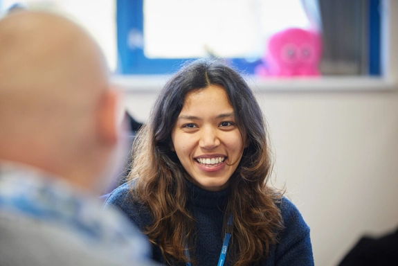 Female staff member smiling