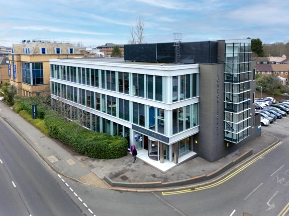 A three-storey building that has signs showing it is called "London House"