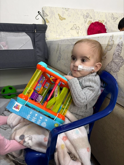 Small Child With A Toy