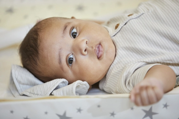Baby on changing mat