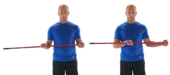 Person holding a stick with elbows at a right angle straight in front of them, and then pushing to the side. 