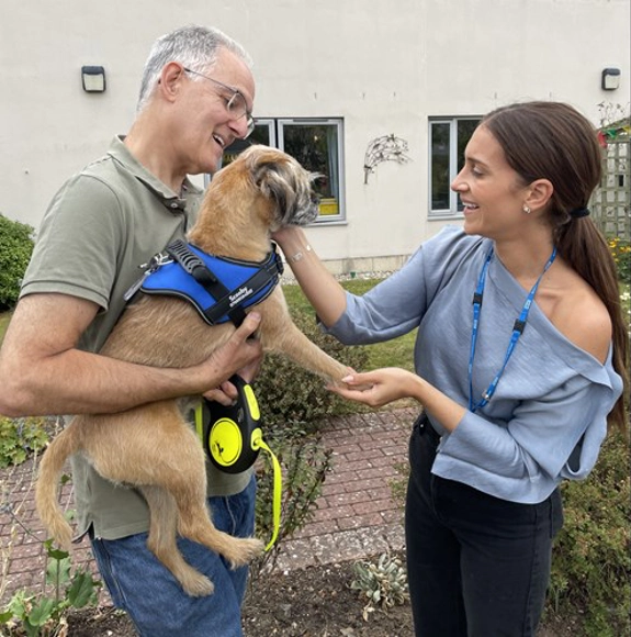 Member Of Staff Meeting A Service Dog