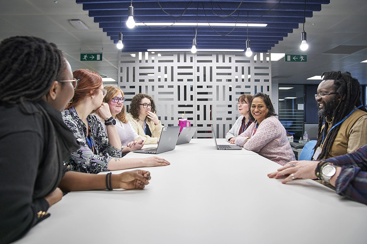 Staff around table in a meeting