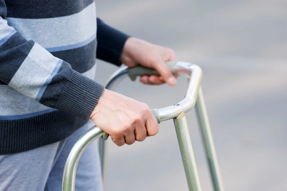 Person Using A Walking Assist Frame