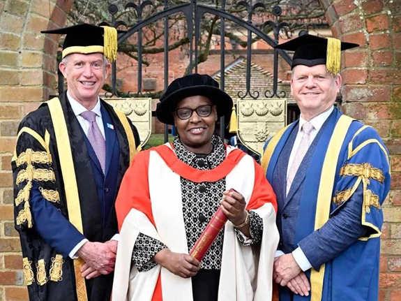 Cecily Mwaniki awarded Honorary Doctorate next to two people from the university of Reading