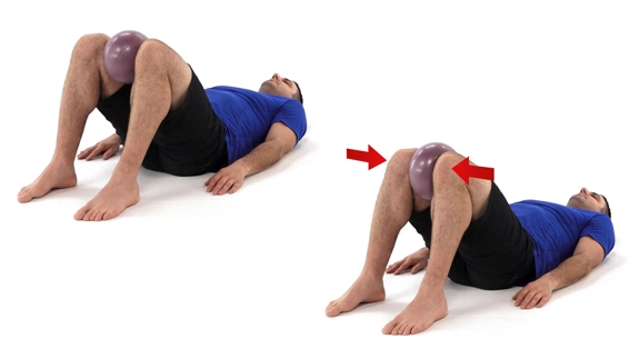 Person lying on the floor with knees bent so feet are flat on the floor, and a ball between their knees. Arrows show knees squeezing the ball inward.